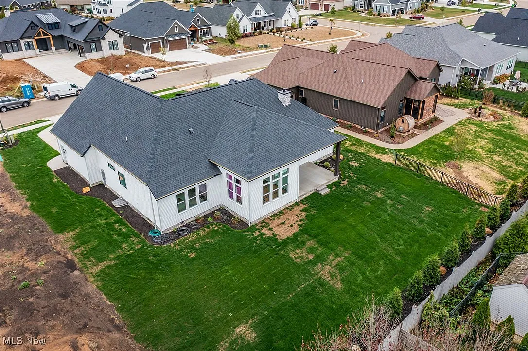 Rear aerial view of the ranch home.